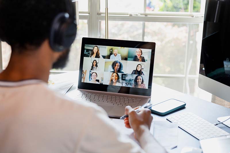 Person on laptop with headset